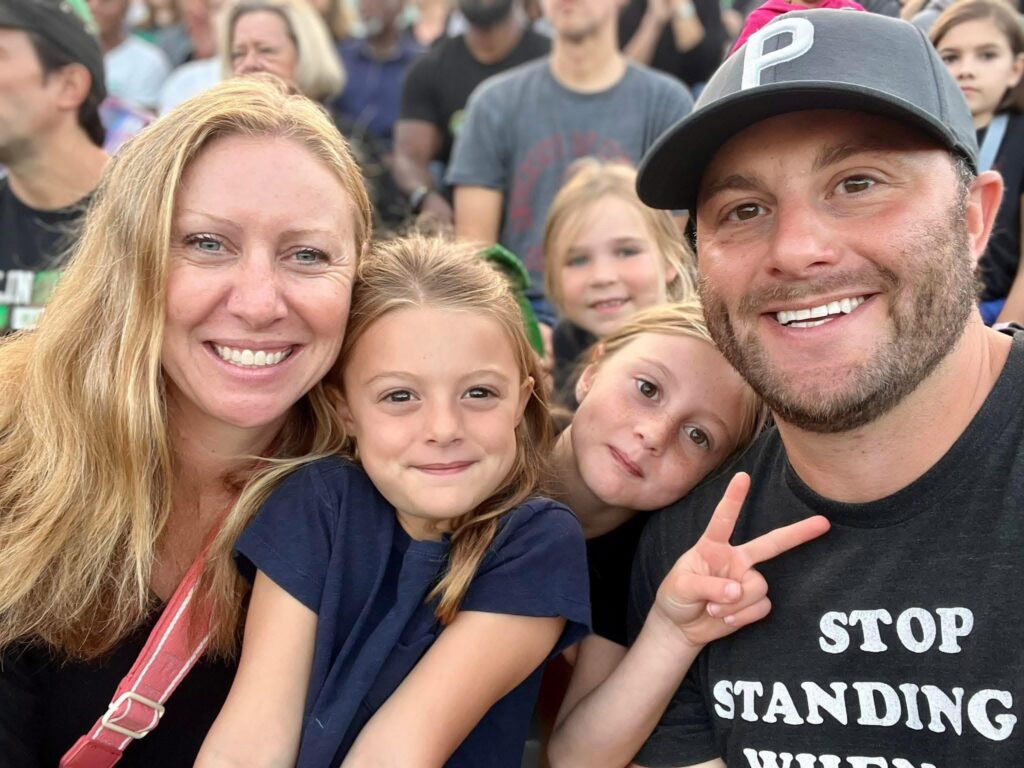 Josh Dawson with wife Lindsay and daughters at a Dublin Coffman vs Jerome football game